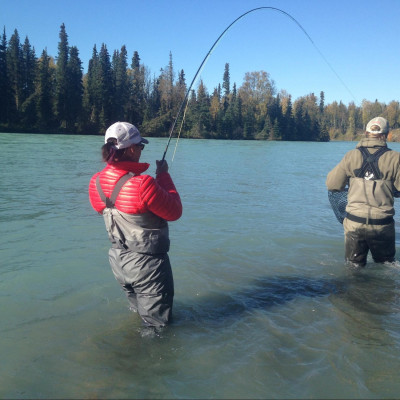 Angler hooked up and guide netting fish