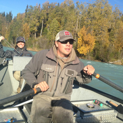 Steelhead guide rowing drift boat