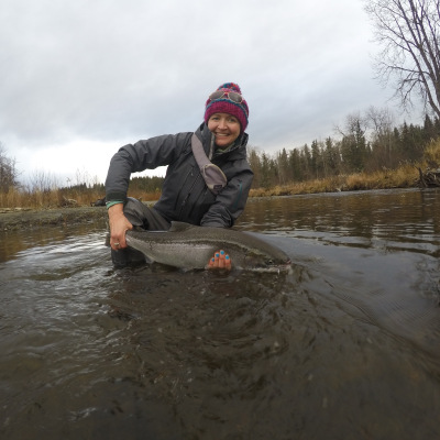 Happy angler releasing Steelhead