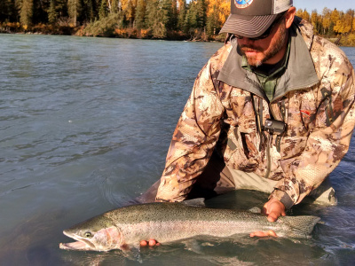 Angler holding a Steelhead