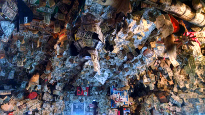 Homer Alaska bar walls covered in dollar bills