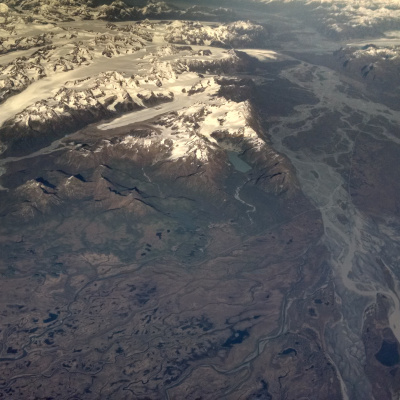Alaska mountain and river view from plane window
