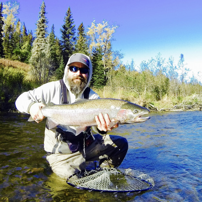 Angler holding Alaska Steelhead