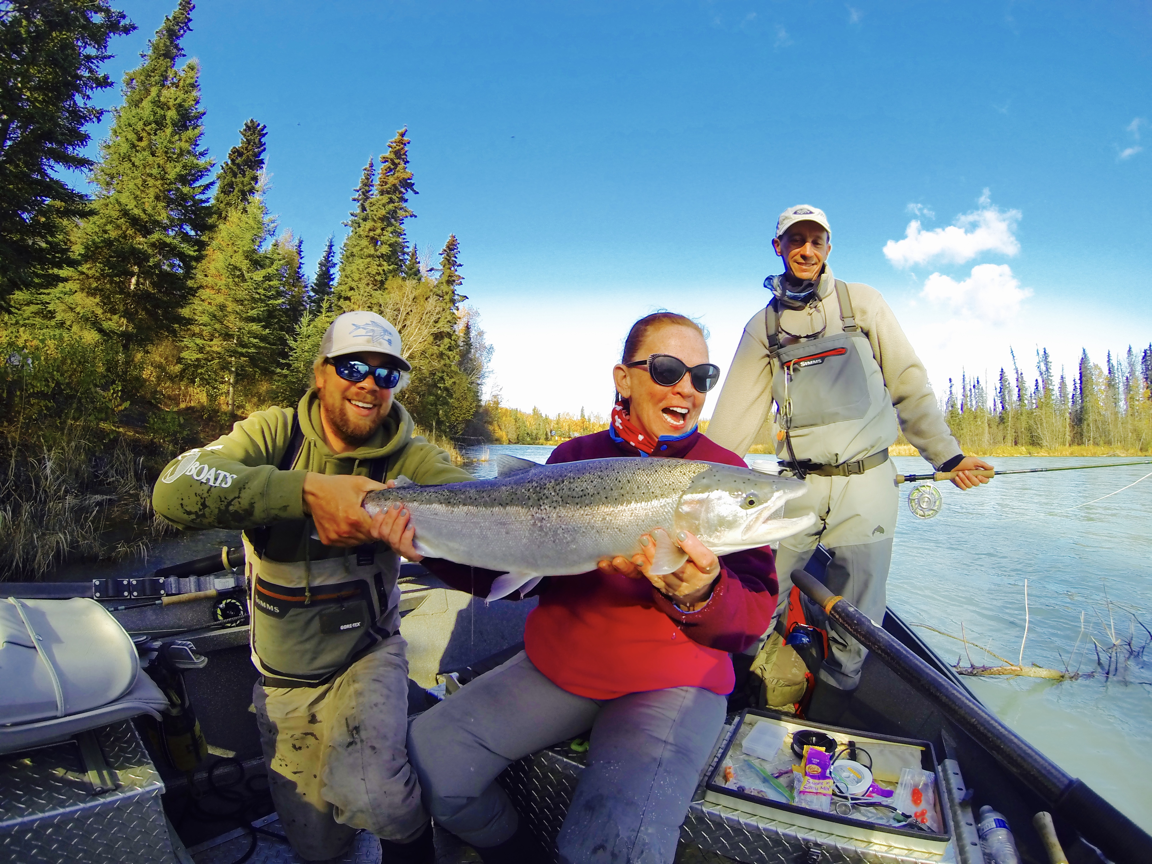 Group of 2 anglers and guide with Steelhead in jetboat