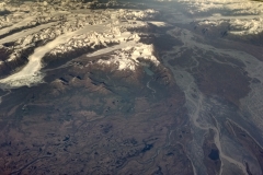 Alaska mountain and river view from plane window
