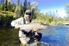 Angler holding Alaska Steelhead