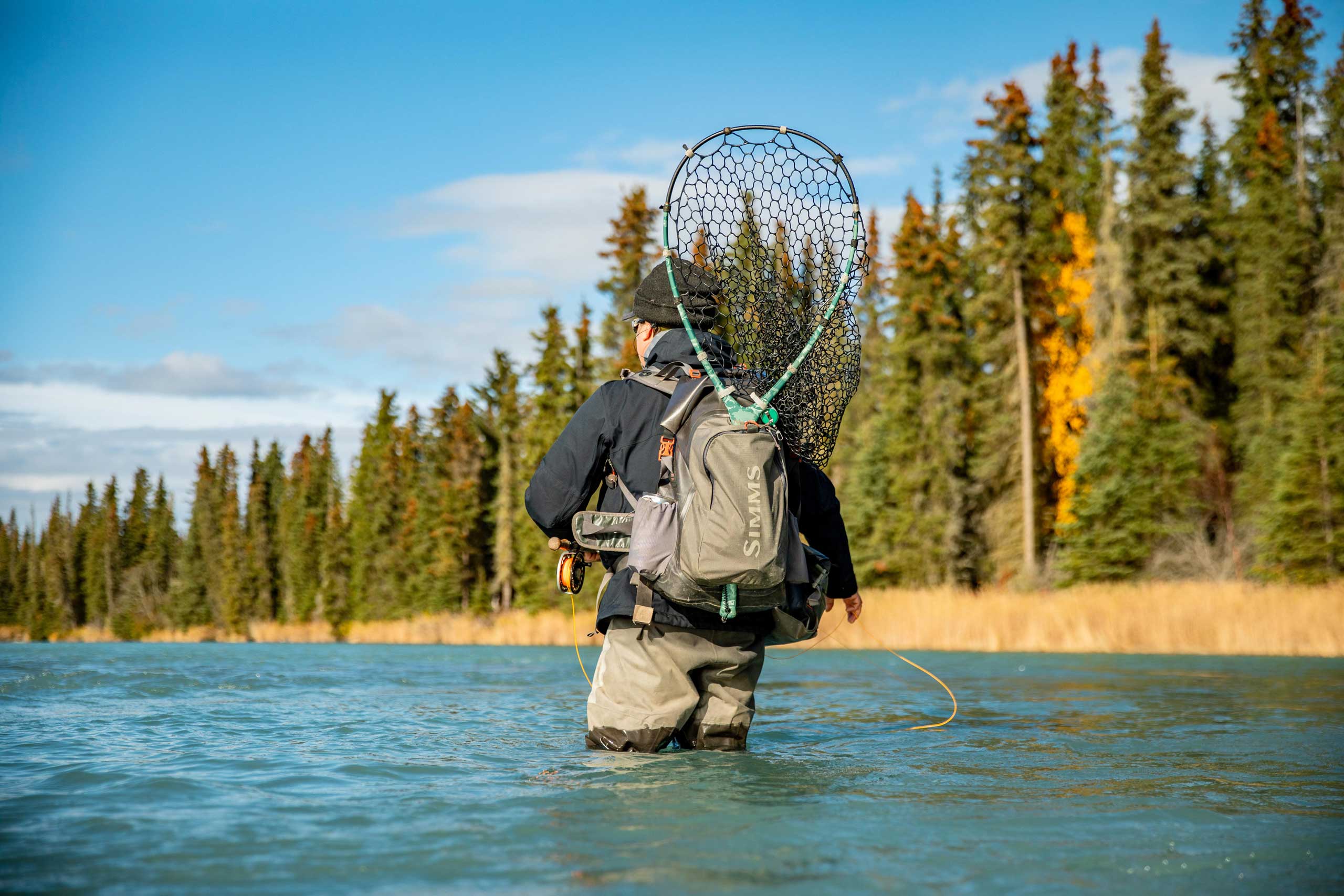 https://www.alaskasteelheadco.com/wp-content/uploads/2022/02/Angler-Wading-With-Net-Etc.jpg